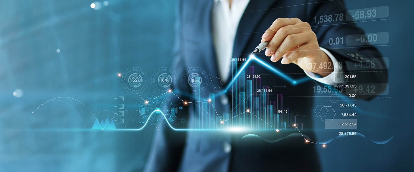 Business professional analyzing financial data with digital graphs.